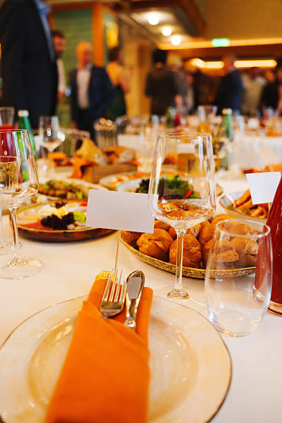 istock Elegant dining setup at a formal event with gourmet dishes and drinks 2207766836