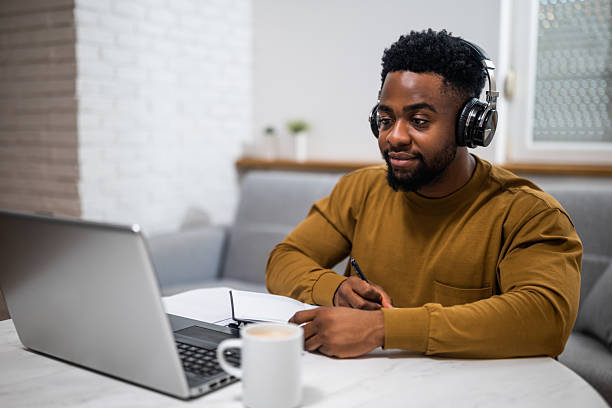 istock Young black man enjoying remote work and learning at home 2207767316