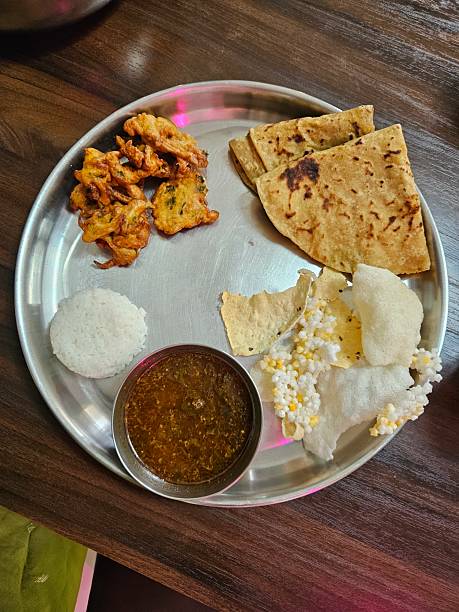 istock Maharashtrian Festive Thali with Puran Poli and Katachi Aamti 2207770402