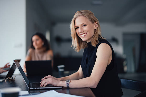 istock Confident Women Collaborating in a Modern Office Environment 2207770879