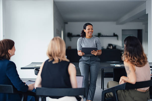 istock Diverse Group of Women Collaborating in Modern Office Environment 2207770918