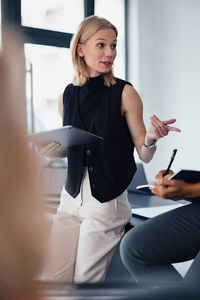 istock Professional Woman Leading a Discussion in a Modern Office Setting 2207770925