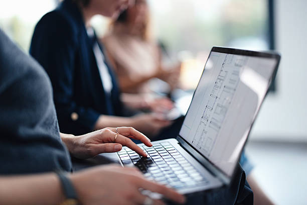 istock Close-Up of Hands Typing on Laptop During Team Collaboration in Office 2207770932