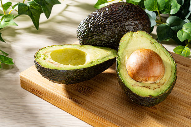 istock Fresh organic avocado on wooden table 2207772382