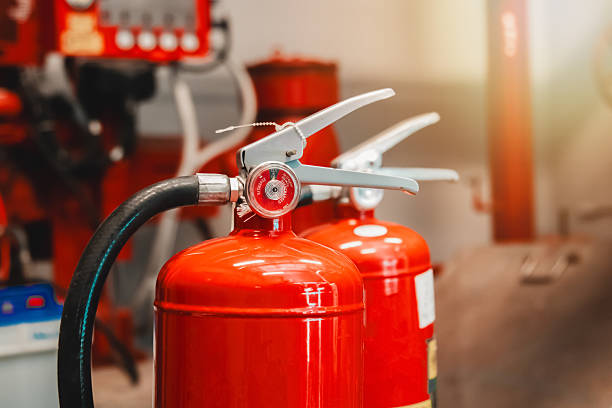 istock Engineer checks fire extinguisher in fire control room to ensure safety. When an emergency occurs 2207775482