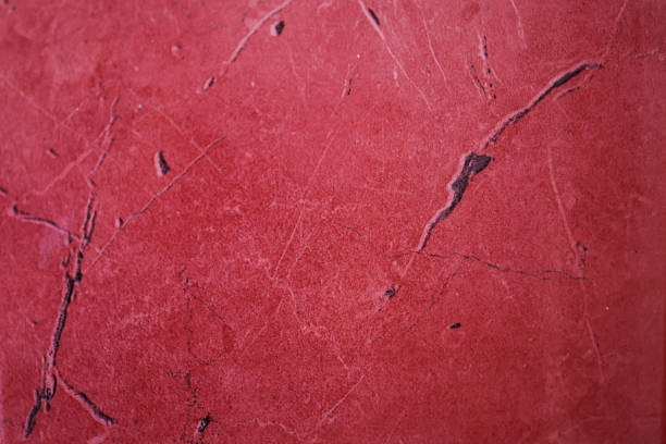 istock A red marble stone surface with organic patterns with natural veins and cracks. 2207776397