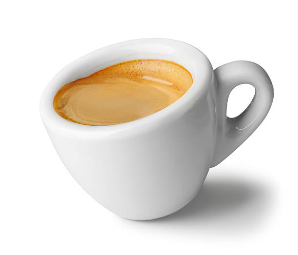 istock Small inclined espresso cup filled with freshly brewed coffee, featuring rich crema on top, isolated on white background, offering simple yet elegant presentation of this popular beverage 2207777499