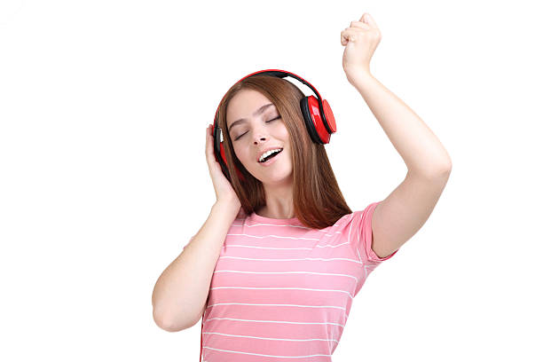 istock Young beautiful woman with headphones on white background 2207777896