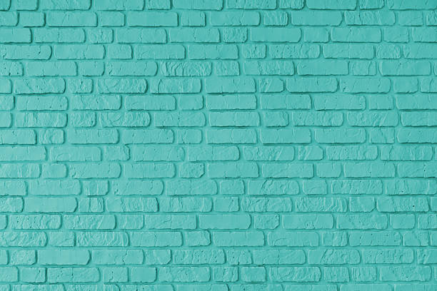 istock Turquoise color painted brick wall texture, brickwork, masonry of stone blocks horizontal background 2207782492