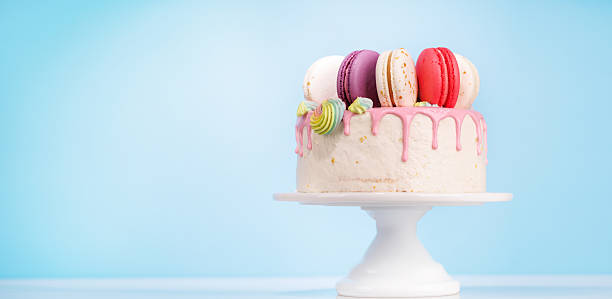 istock A beautifully decorated cake adorned with colorful macarons 2207782787