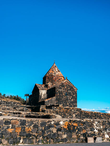 istock Scene of the ancient Sevanavank Monastery on the hill, blue sky background, vertical. Historical churches and cathedrals at the northwestern shore of Lake Sevan in the Gegharkunik Province of Armenia. 2207785178