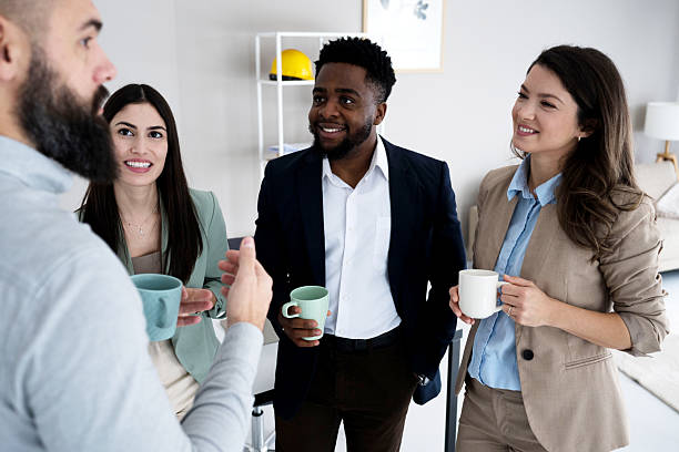 istock Group of business people standing and talking 2207787279