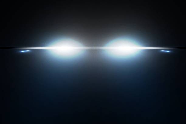 istock Vector light from the headlights PNG. Light from the headlights of a car on an isolated transparent background. Round headlights, yellow light PNG. 2207789205
