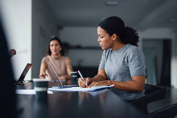Two Professional Women Collaborating in a Modern Office Space
