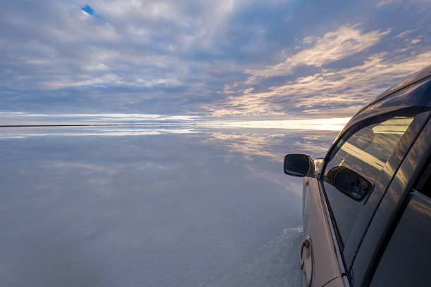 istock Car Driving Across Salar de Uyuni with Sky Reflection 2207791254