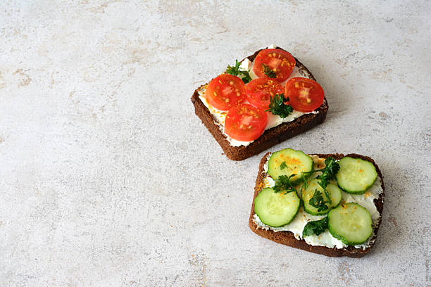 istock Two Delicious Sandwiches with Fresh Tomatoes and Cucumber copy space 2207794968