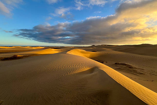 istock A colorful sunset at a Maspalomas dune, Gran Canaria island 2207795310