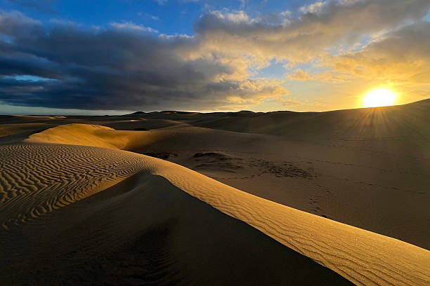 istock A colorful sunset at a Maspalomas dune, Gran Canaria island 2207795362