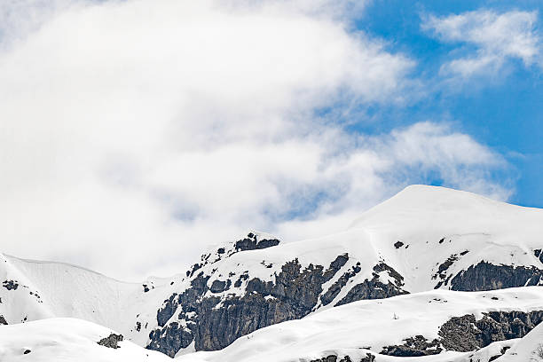 Bergamo Alps peak and clouds after snowstorm,