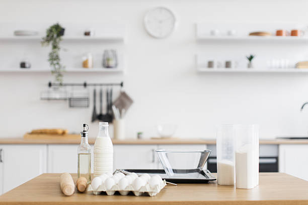 istock Modern kitchen counter with ingredients for baking, soft neutral tones 2207797198
