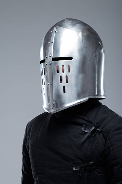 istock Closed Medieval Helmet with Slits. Polished silver helmet fully enclosing the head with vertical and horizontal viewing slits. 2207797437