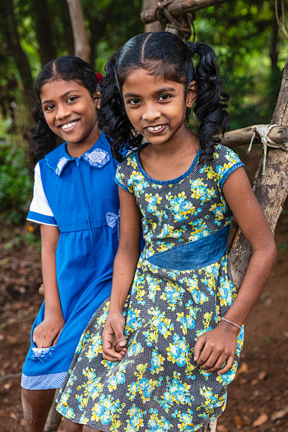 istock Two Sri Lankan young girls resting in a forest 2207799880
