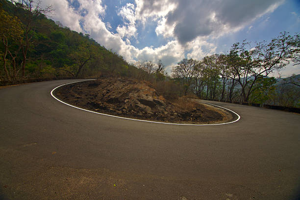 View of the dramatic hairpin bend on forest road to Valparai from Athirampilly in Kerala, India