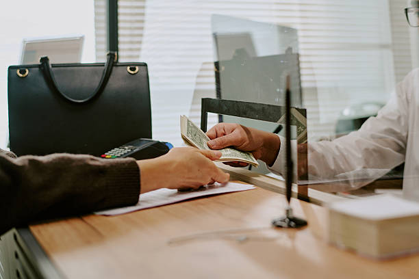 istock Handing Over Cash Payment in Office Setting 2207801861