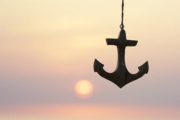 Bow of big ship with an anchor  and sunset