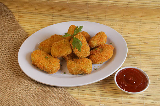 istock Fried nuggets with sauce. a plate of nuggets for snacks 2207803562