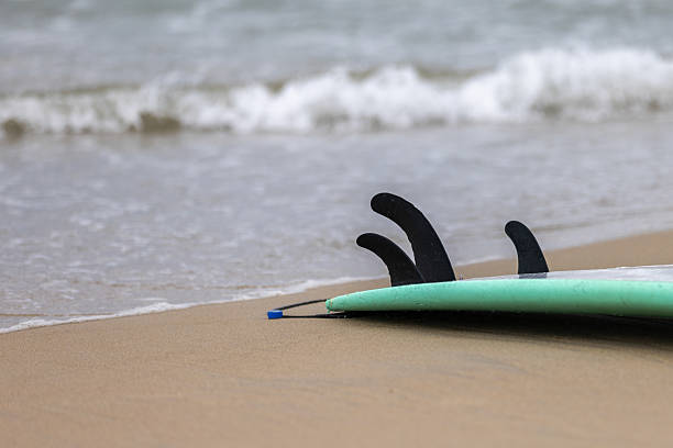 istock Surfboard on sands with seascape. 2207804554
