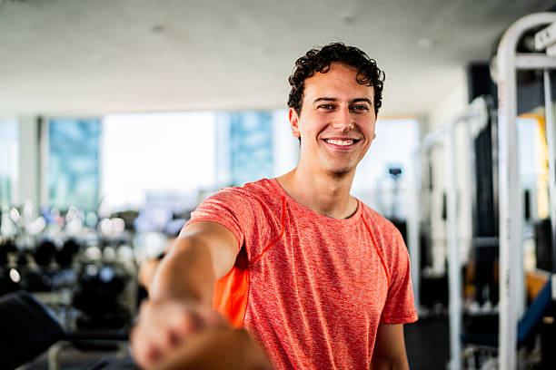 istock Young man greeting friend at gym 2207806571