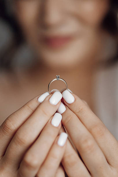 istock A woman is holding a ring in her hand 2207807188