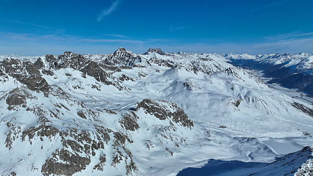 istock Alpine landscape with peaks covered by snow and bleu sky without clouds 2207808231