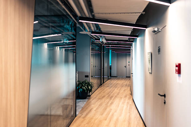 istock Modern office hallway with stylish lights and a bright professional atmosphere 2207814288