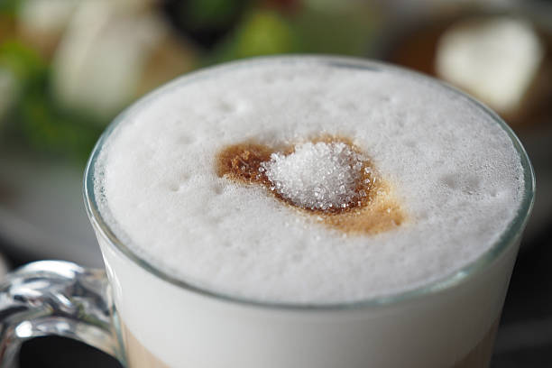 istock white sugar pouring from a in a paper packet on a coffee cup 2207817281