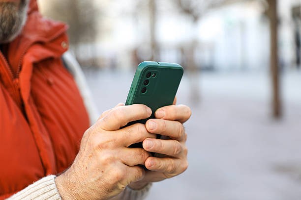 istock Man in his 50s using a smartphone. Close up 2207818371
