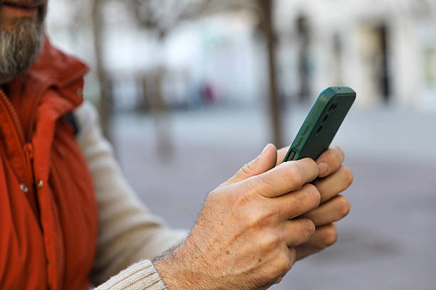 istock Man in his 50s using a smartphone. close up 2207818381