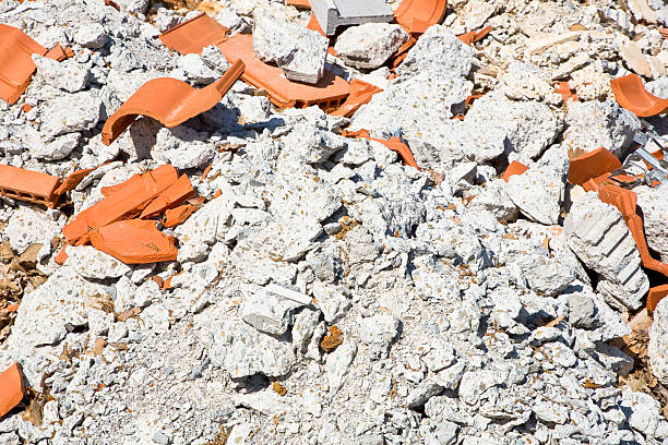 Concrete and brick rubble debris on construction site after a demolition of a building