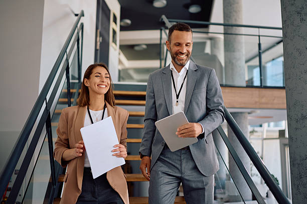 istock Happy entrepreneurs walking through an office building. 2207820923