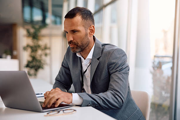 istock Male entrepreneur using laptop while working in the office. 2207820980