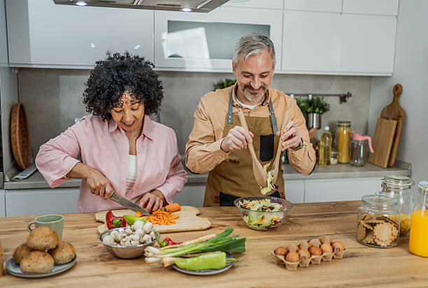 istock Mature couple making a fresh healthy meal 2207823673