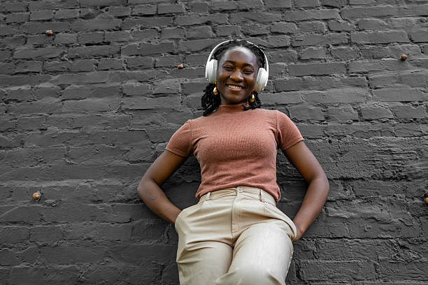 istock smiling girl with headphones 2207826938