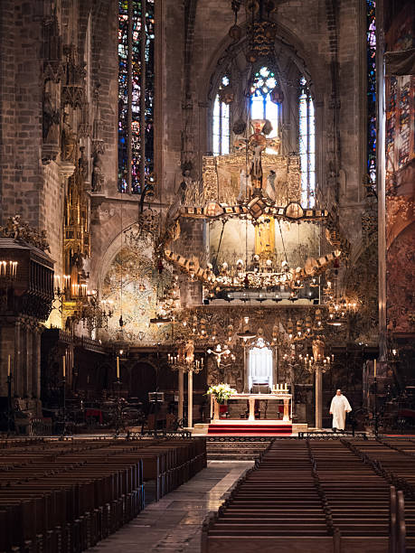 Palma de Mallorca, Spain; October 13th 2024: Inside the Cathedral of Palma de Mallorca. A priest is preparing for mass