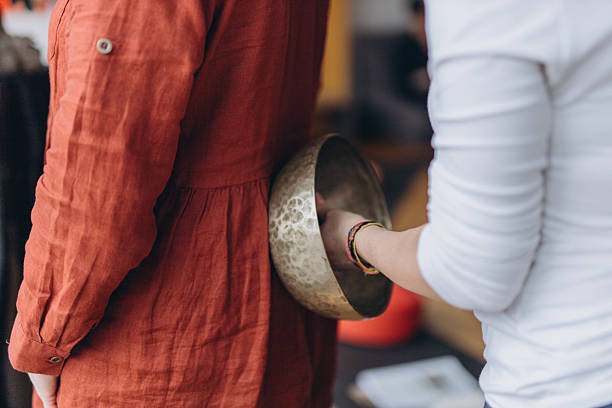 istock Therapy session with Tibetan singing bowls . Meditation and relaxation 2207829217