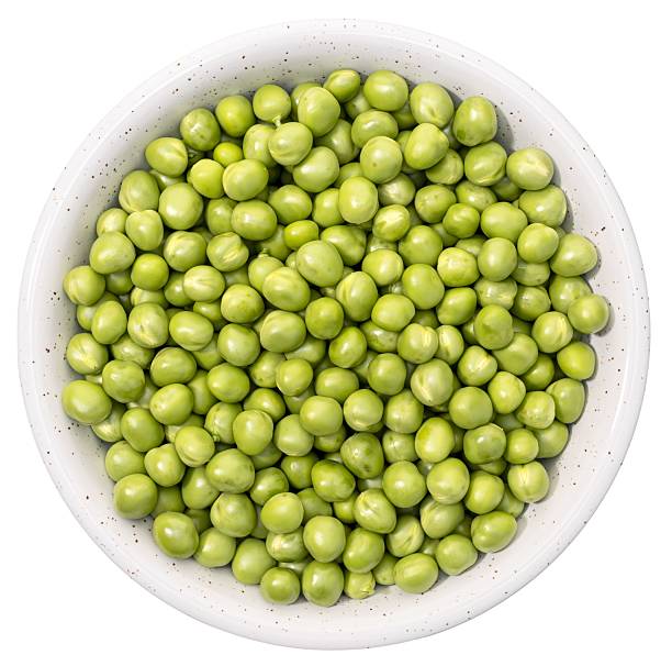 istock Fresh green peas in bowl isolated on white background 2207832554