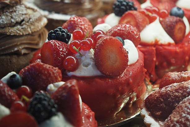 Delicious and delightful Berry Tarts topped with Whipped Cream and Fresh Fruits