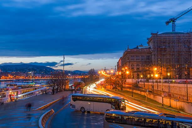 Budapest, Hungary - March 14, 2025:  Long exposure view of Pest side and Danube river from Szechenyi Chain Bridge (Széchenyi Lánchíd)
