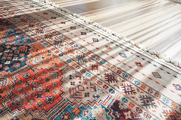 istock A patterned rug rests on the flooring beside a mirror 2207834139