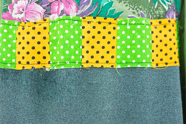 Stitched fabric scraps. Fabric texture. Details of homemade patterns. Collage of fabric pieces.